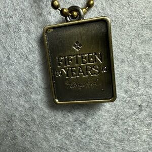 Patricia Nash Brass Tone 'Fifteen Years' Rectangular Pendant Necklace